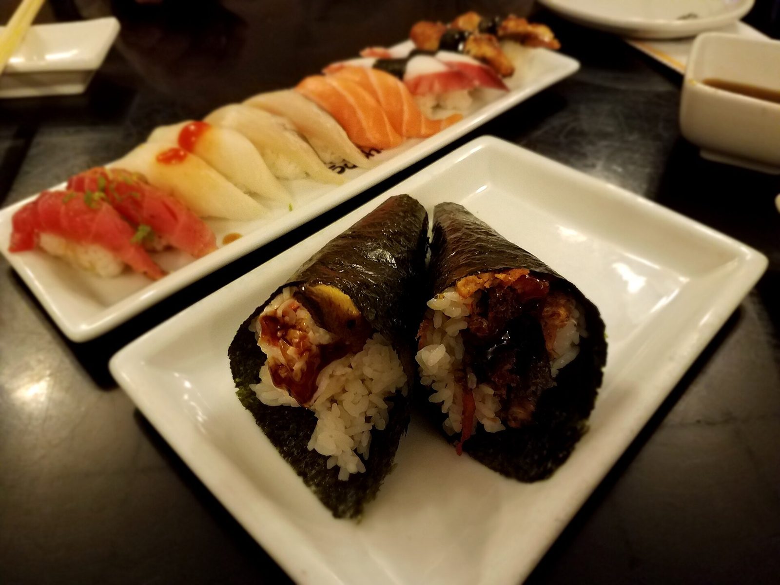 An assortment of nigiri sushi and hand rolls